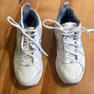 New Balance women’s White and Blue Sneakers
